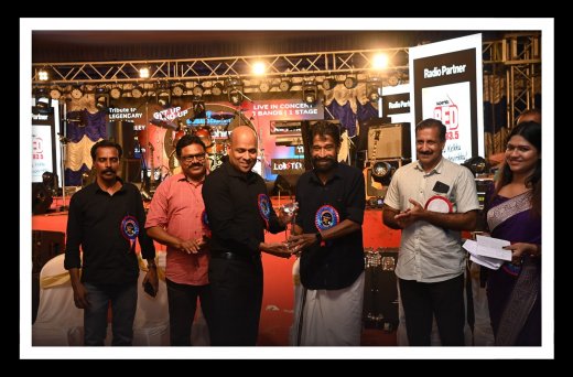 Rajesh Puthanpurayil receiving an award at a special ceremony